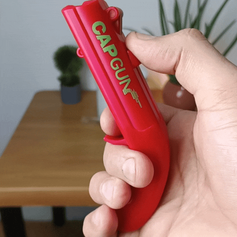 Destapador de botellas con disparo de tapas.
