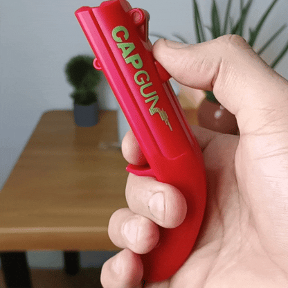 Destapador de botellas con disparo de tapas.